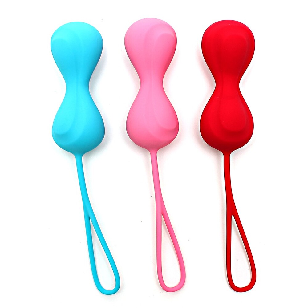 Three colorful silicone tools with handles on a white background