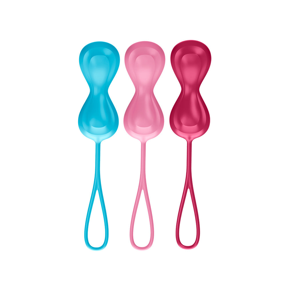 Three colorful plastic spoons on a white background