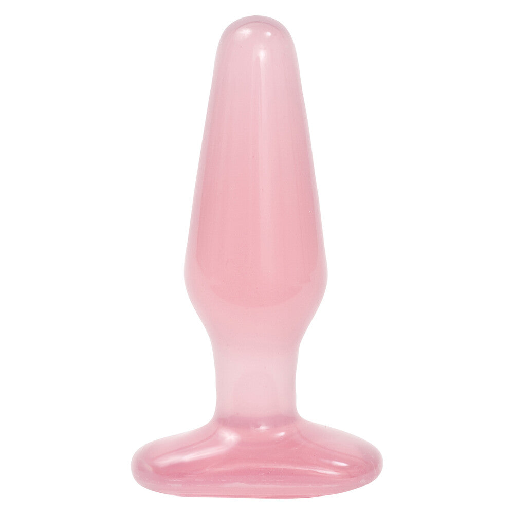 Pink silicone butt plug on a white background