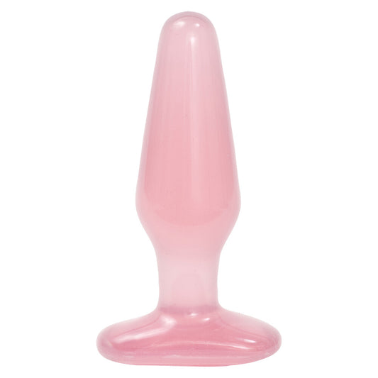 Pink silicone butt plug on a white background