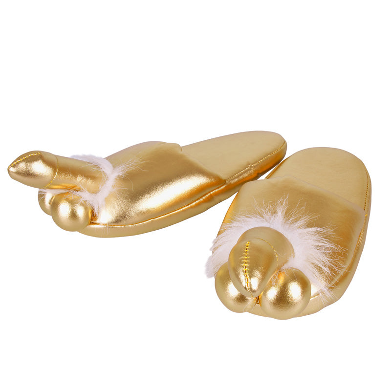 The image shows a pair of gold penis slippers, designed to fit up to size 42, with a white fluffy tip. The slippers are made of polyester and are intended for both men and women.