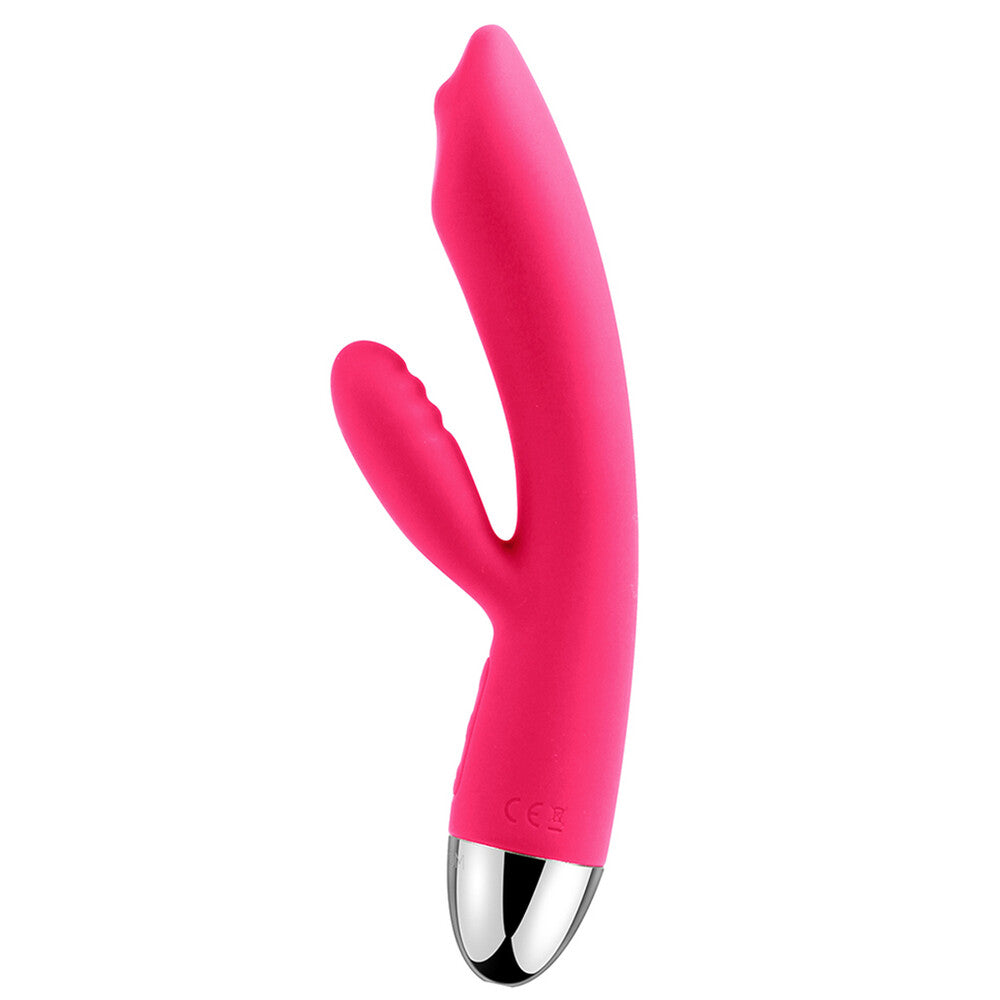 A bright pink, uniquely shaped vibrator with a smaller arm for clitoral stimulation and a rolling ball at the base for targeted stimulation. The device has a sleek, smooth surface with a shiny metallic tip.