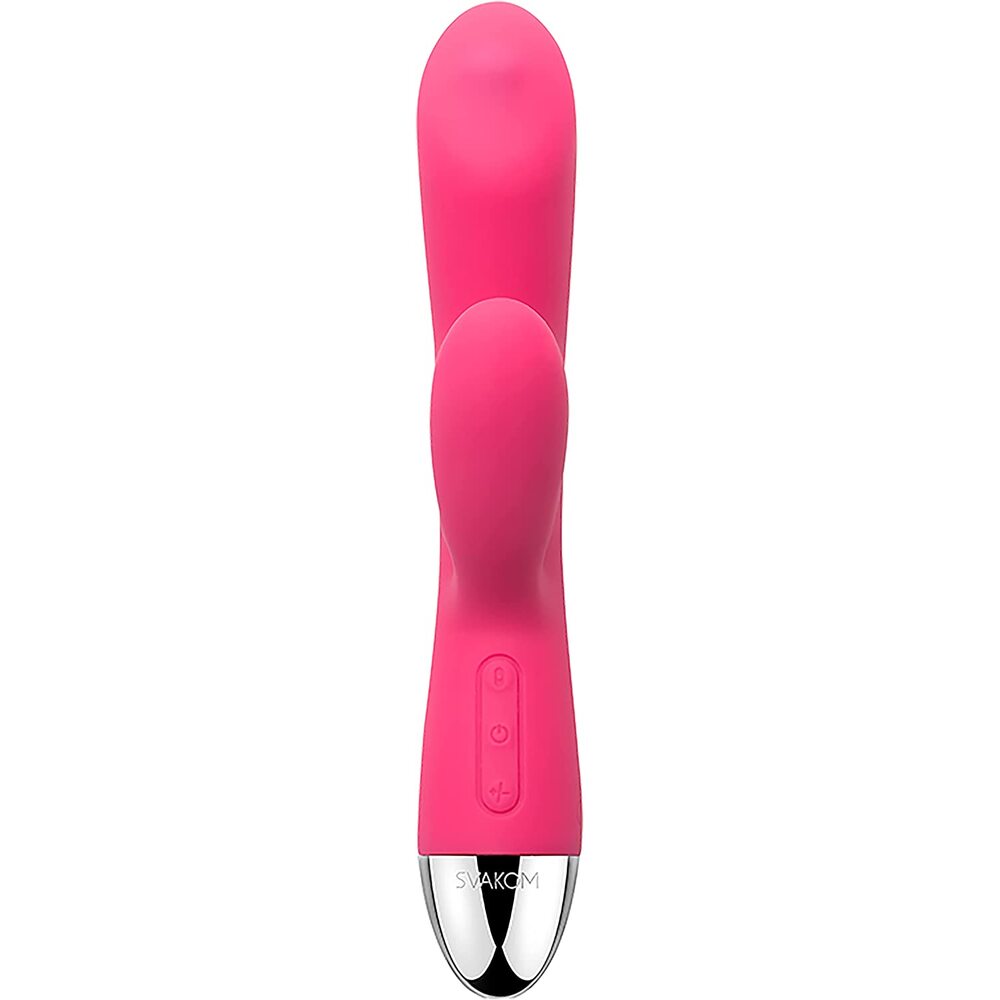 A bright pink, uniquely shaped vibrator with a smaller arm for clitoral stimulation and a rolling ball at the base for targeted stimulation. The device has a sleek, smooth surface with a shiny metallic tip.