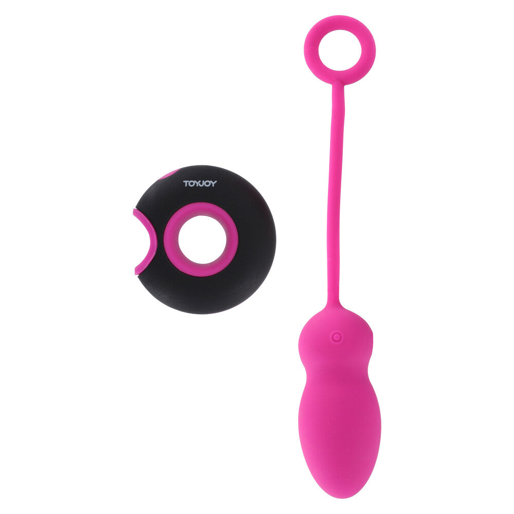 A pink remote-controlled egg with a sleek design and a black remote control featuring a single button for operation.