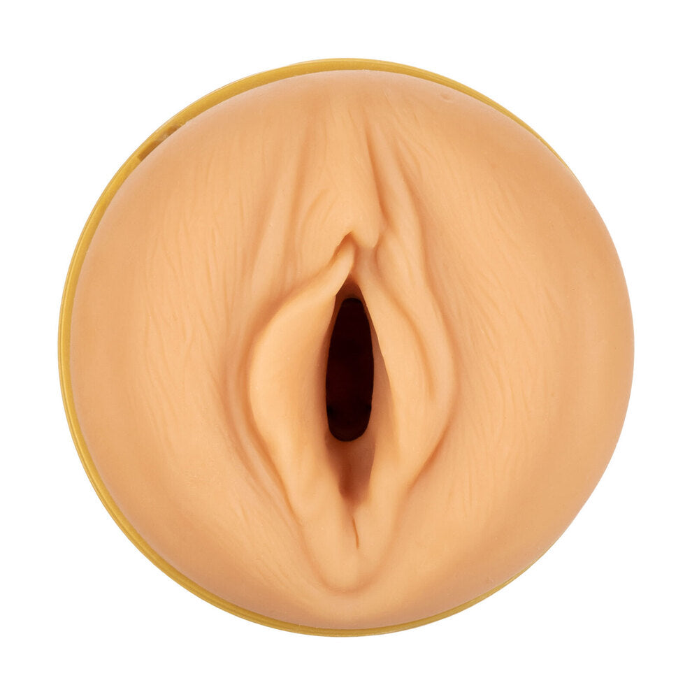 A flesh-colored masturbator tube with realistic texture, shown disassembled with the end cap off to reveal the interior. The device appears to be made of smooth, skin-safe rubber.