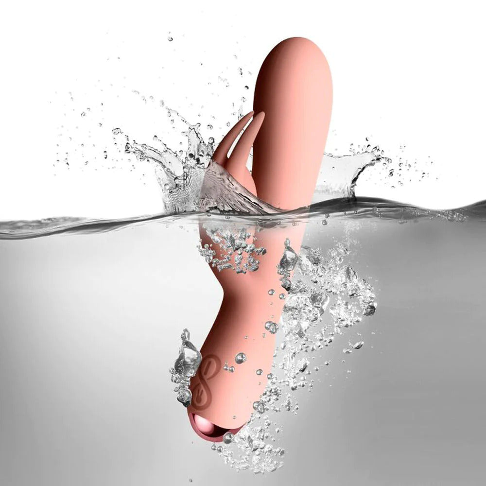 A pink, ergonomically designed vibrator with soft silicone ears and a curved shaft, depicted in a sleek, smooth finish.