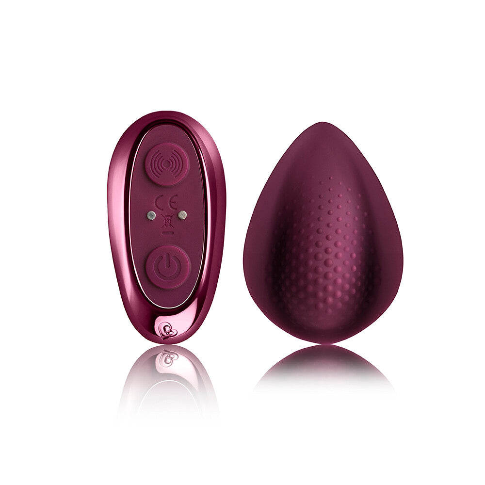 Purple electronic device with a smooth counterpart on a white background