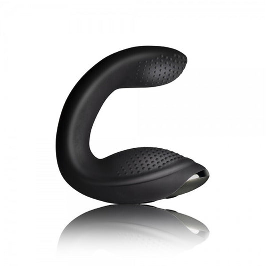 Black curved object with textured surface on a white background