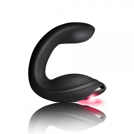 Black curved device with red light on a white background