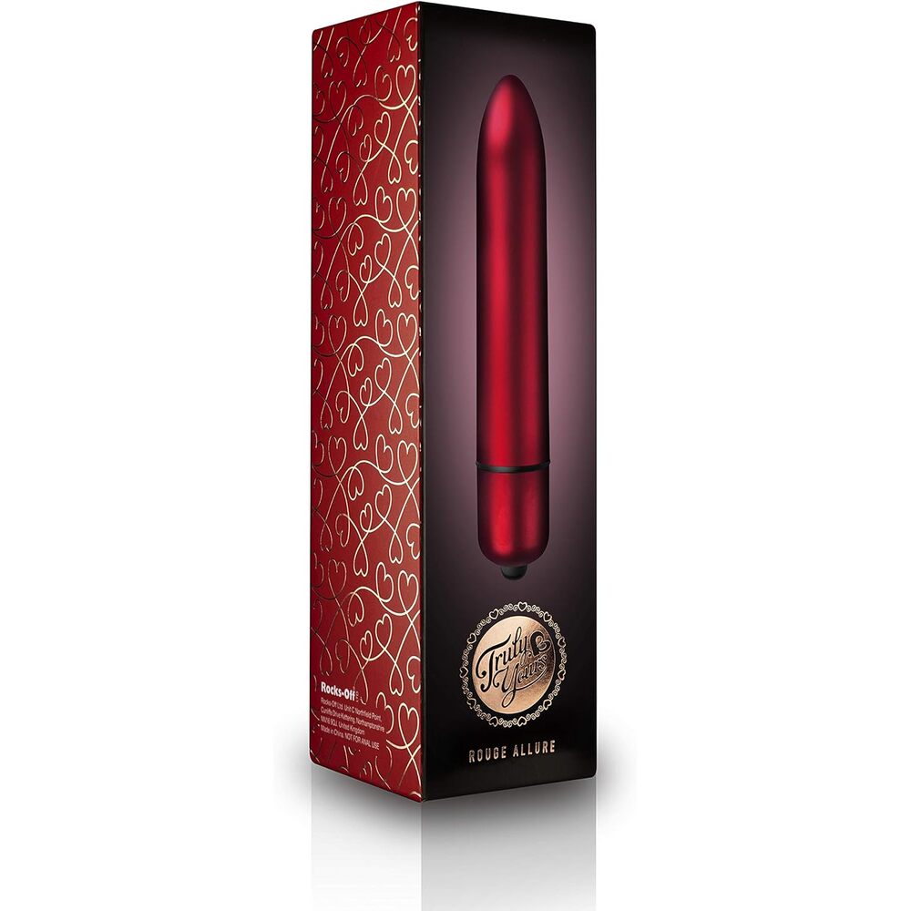 A red, bullet-shaped vibrator being held in a hand, showcasing its compact size and smooth surface.