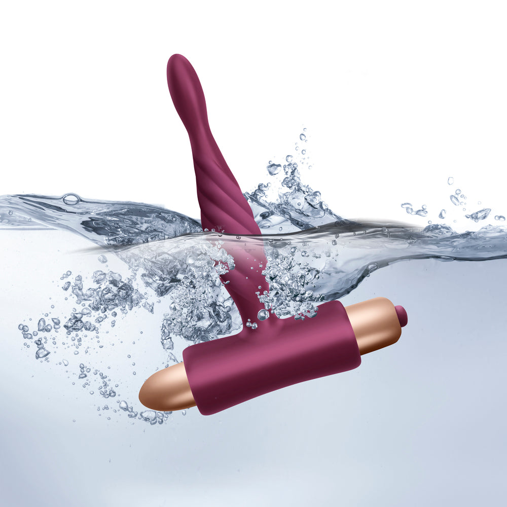 The image shows two maroon-colored silicone vibrators, one designed for vaginal insertion and the other for clitoral stimulation, along with their remote controls.