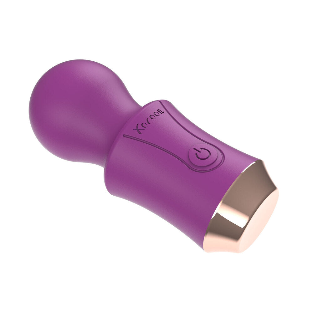 A purple, handheld wand massager with a rounded head and a built-in power button, branded XOCOON.