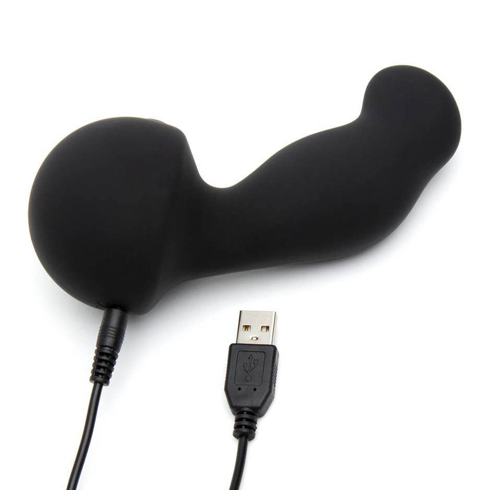Black silicone device with USB connection on a white background