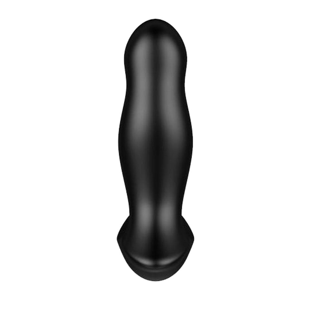 Black rubber dildo on a white background
