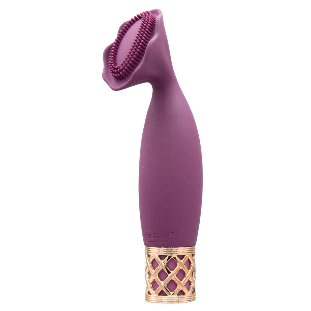 A handheld mini massager with a flexible, petal-shaped head and a gold-accented base, finished in purple.