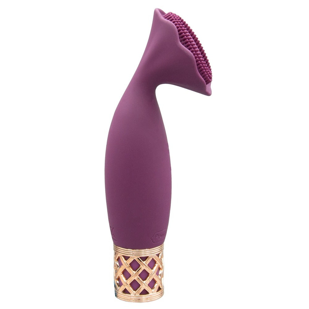 A handheld mini massager with a flexible, petal-shaped head and a gold-accented base, finished in purple.