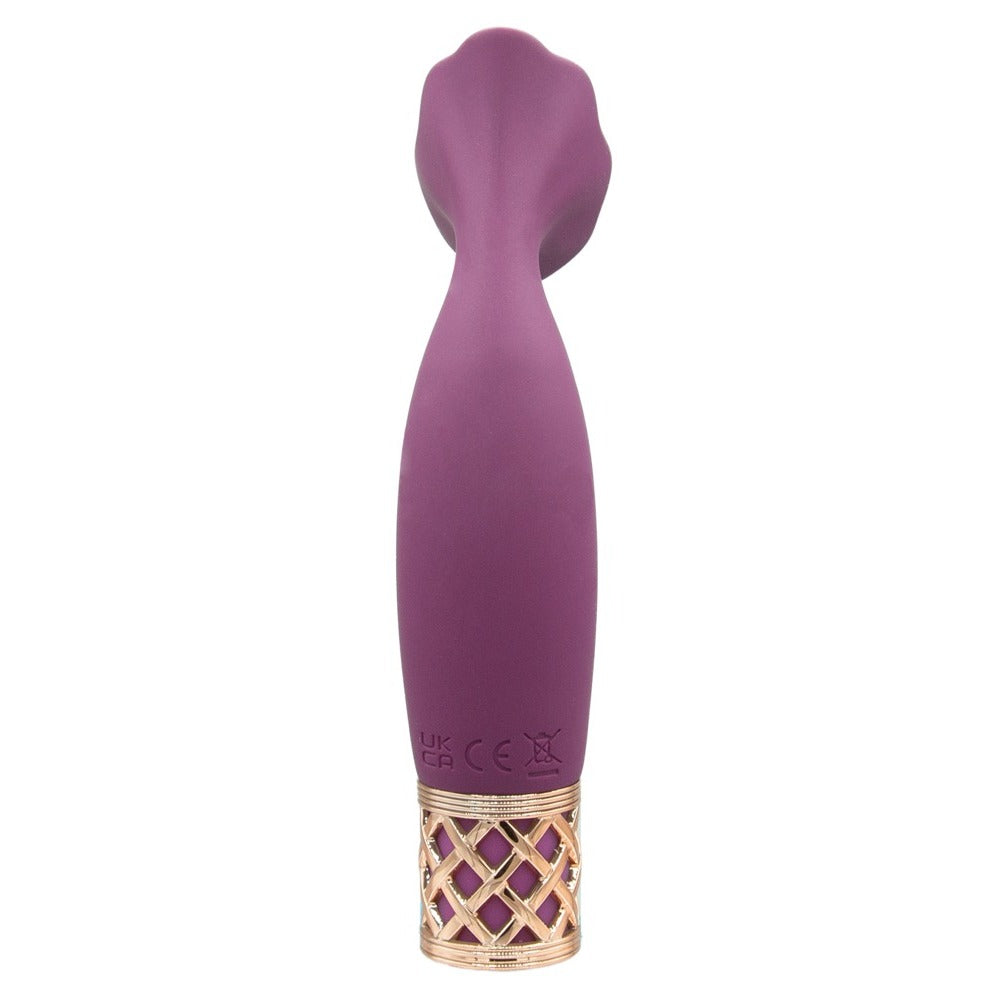 A handheld mini massager with a flexible, petal-shaped head and a gold-accented base, finished in purple.