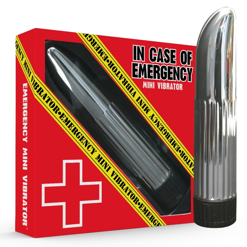 A silver-colored vibrator in a plastic package, labeled as 'In Case of Emergency Mini Vibrator' with a red cross and yellow caution tape design.