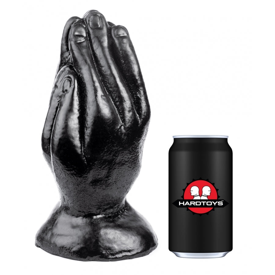 Black praying hands sculpture next to a black can with a red logo on a white background