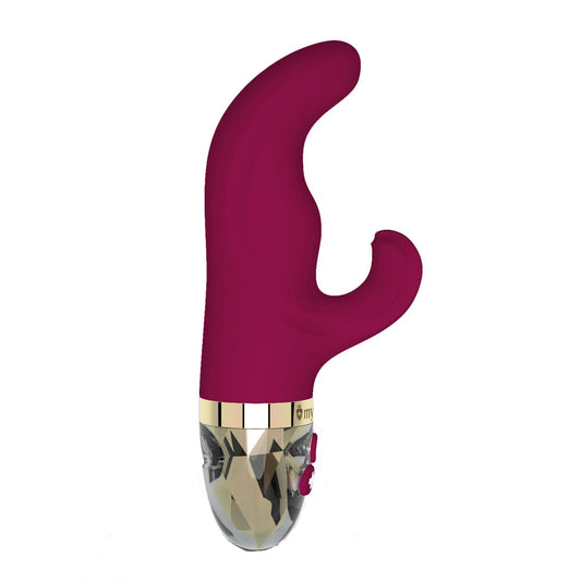A pink, bunny-shaped vibrator with a curved handle and a small motor housing at the base, featuring a transparent detail.