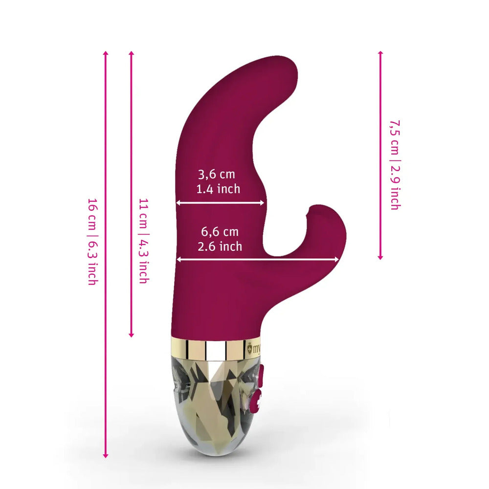 A pink, bunny-shaped vibrator with a curved handle and a small motor housing at the base, featuring a transparent detail.