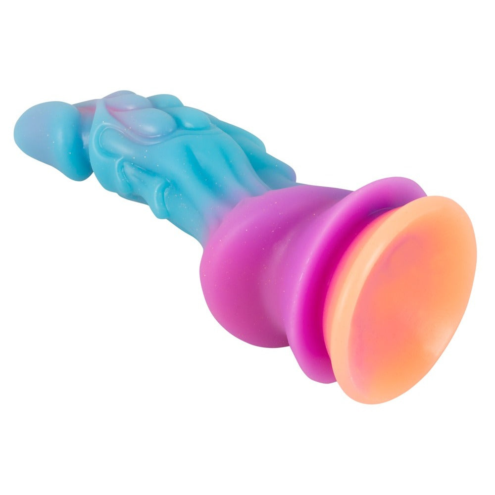 Colorful toy with a gradient from blue to pink to orange on a white background