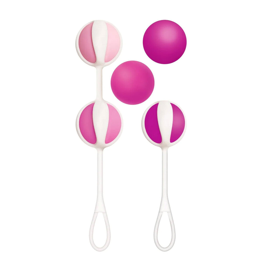 The image shows a set of pink weighted balls attached to white silicone straps, with varying sizes to create different weight combinations.