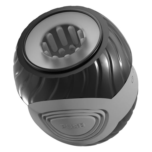 A gray, donut-shaped masturbator with a textured interior, featuring a power button on the side and an open design at both ends.