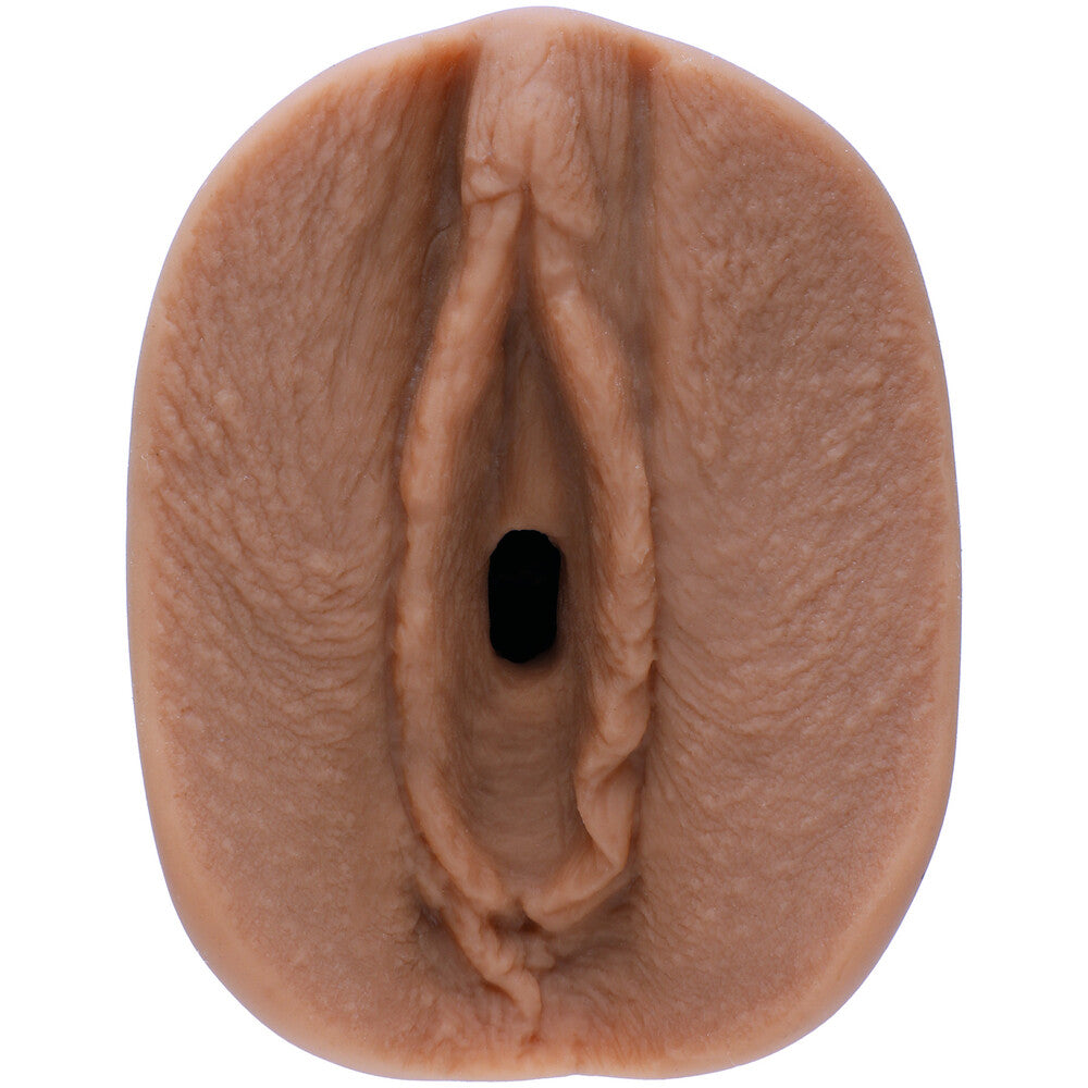Realistic silicone model of a female reproductive organ on a white background