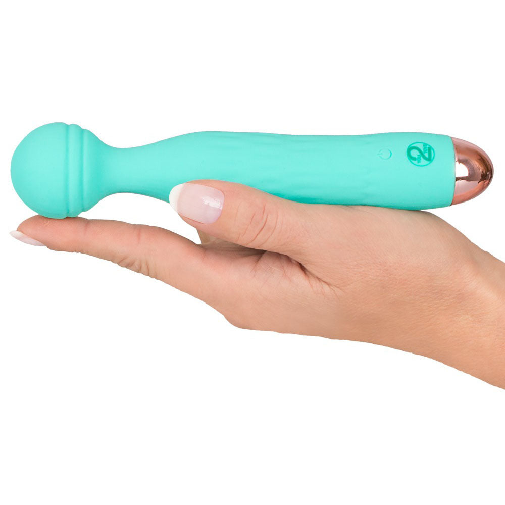 A small, green, silicone mini vibrator with a grooved texture on the head and a sleek handle, showing the brand's logo near the base.