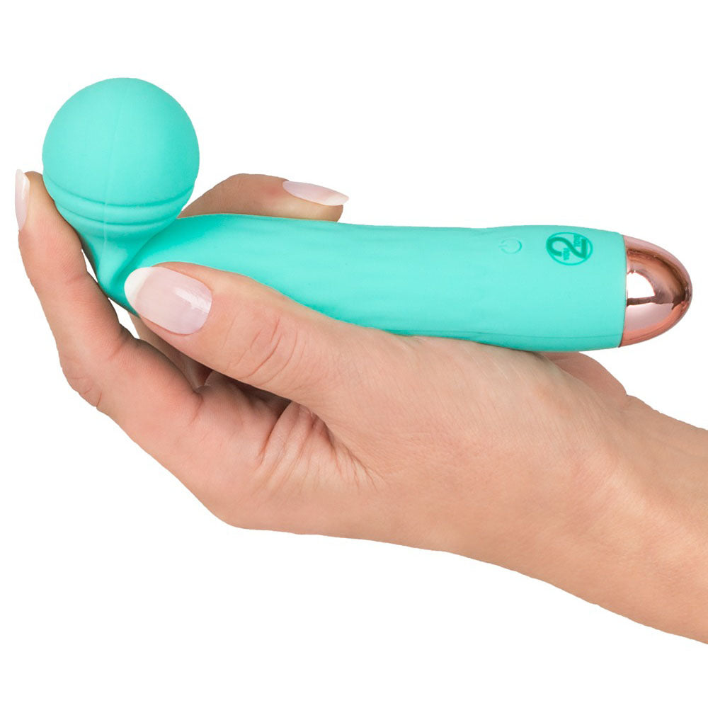 A small, green, silicone mini vibrator with a grooved texture on the head and a sleek handle, showing the brand's logo near the base.