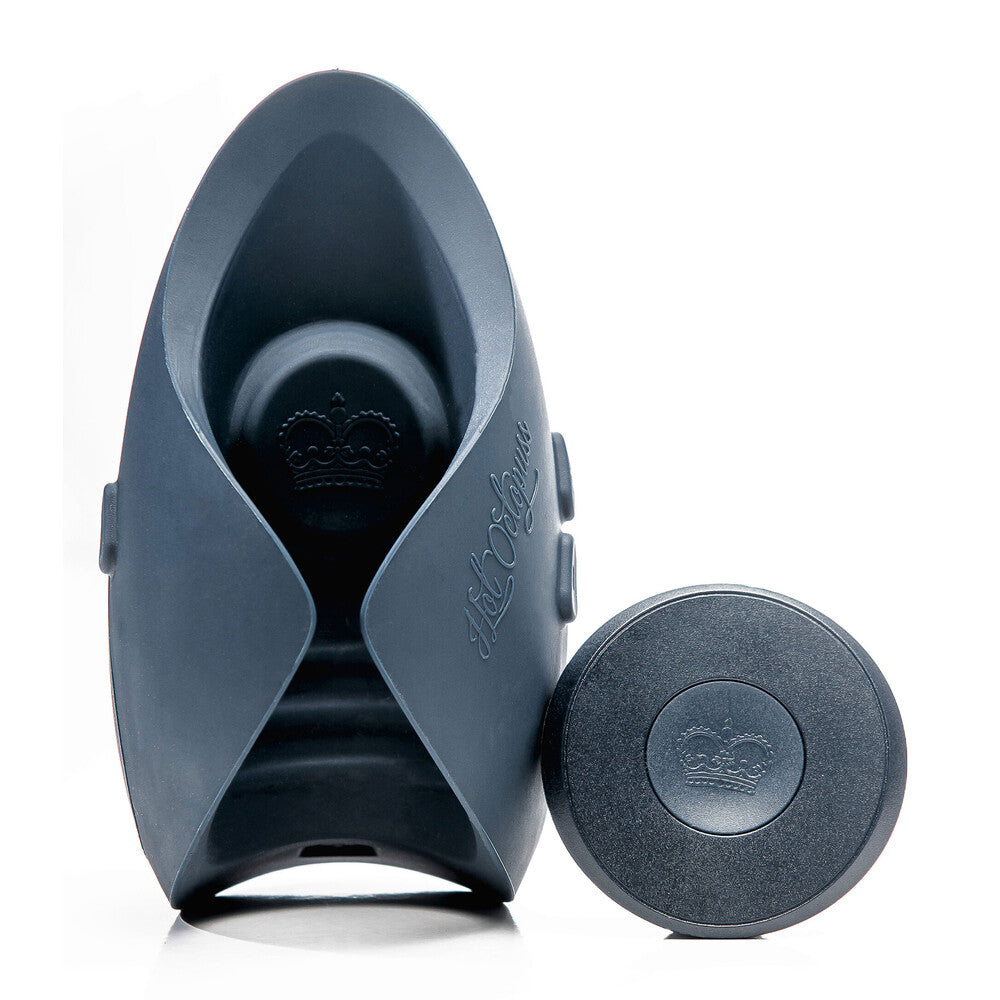 A blue Pulse Duo Guybrator Masturbator with Pulse Plate Technology, alongside its remote control. The toy has a sleek, ergonomic design with a circular base and a more angular, cushioned section.