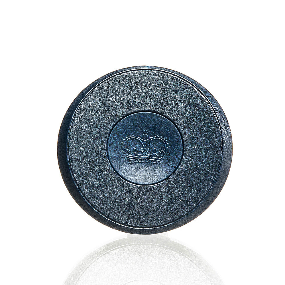 Round black object with a crown emblem on a white background