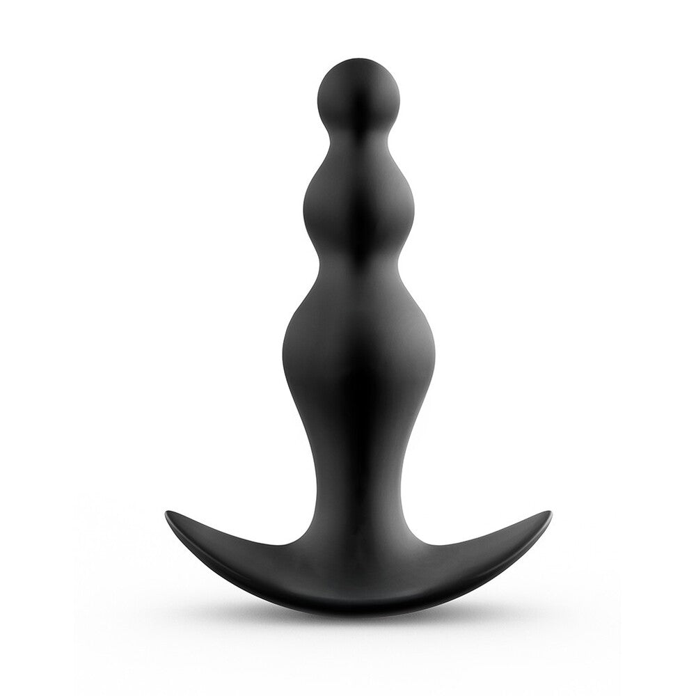 Black abstract sculpture on a white background