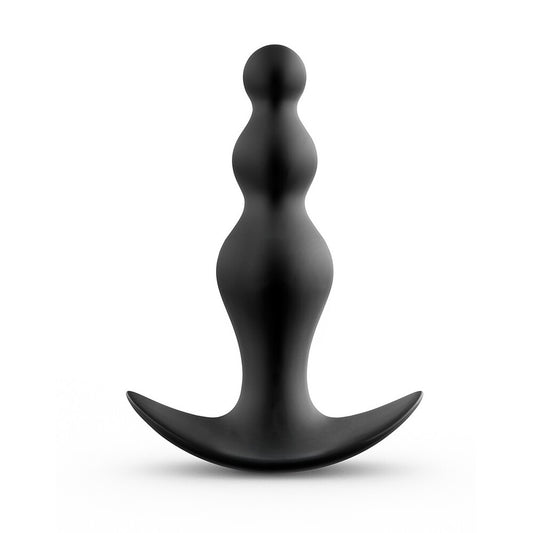 Black abstract sculpture on a white background