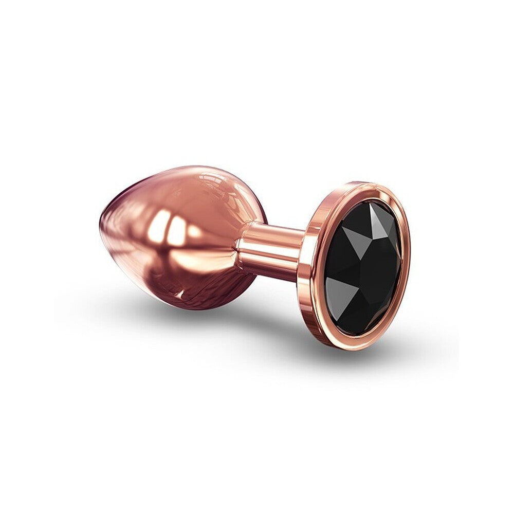 Rose gold anal plug with black gemstone on a white background