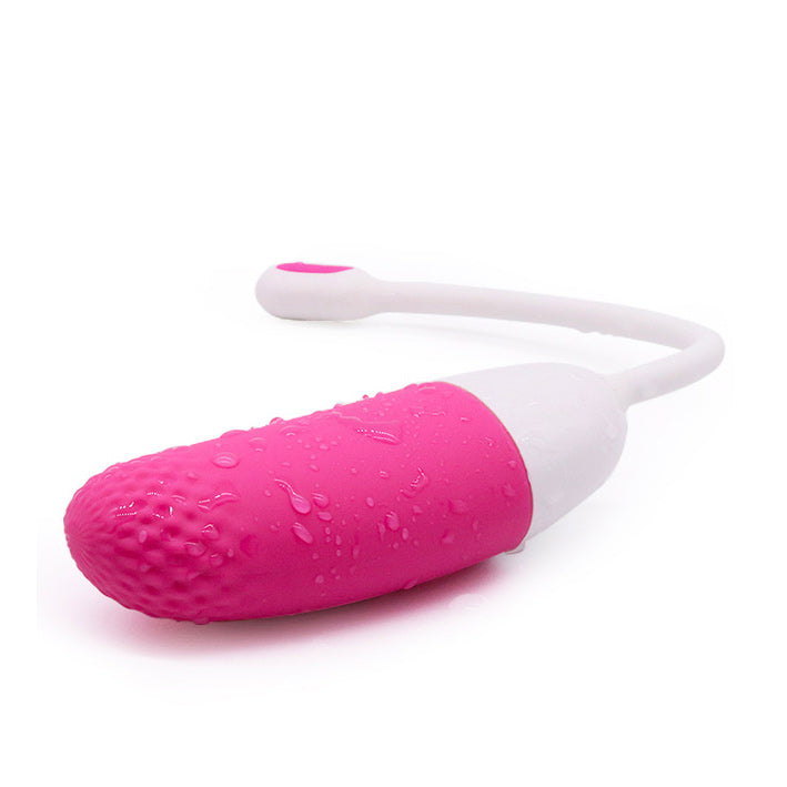 Pink and white personal care tool on a white background