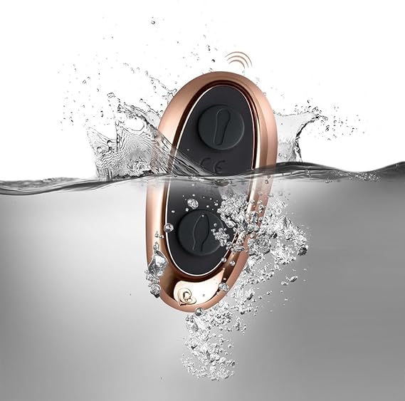 Rose gold and black device emerging from water with water droplets around it