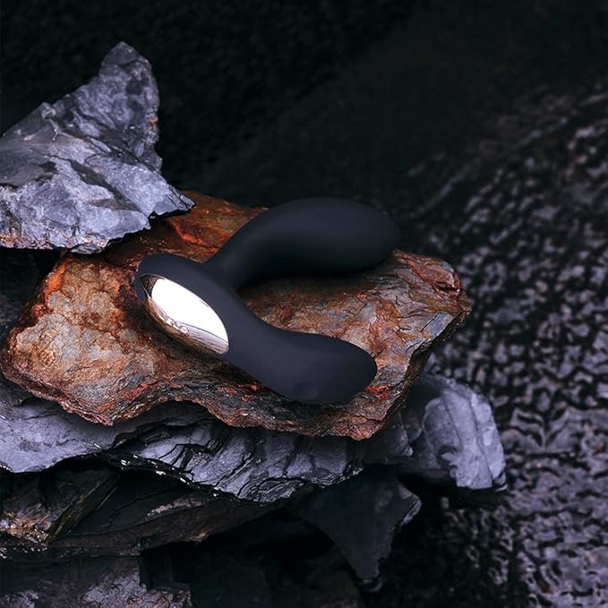 Black electronic device on a rocky surface