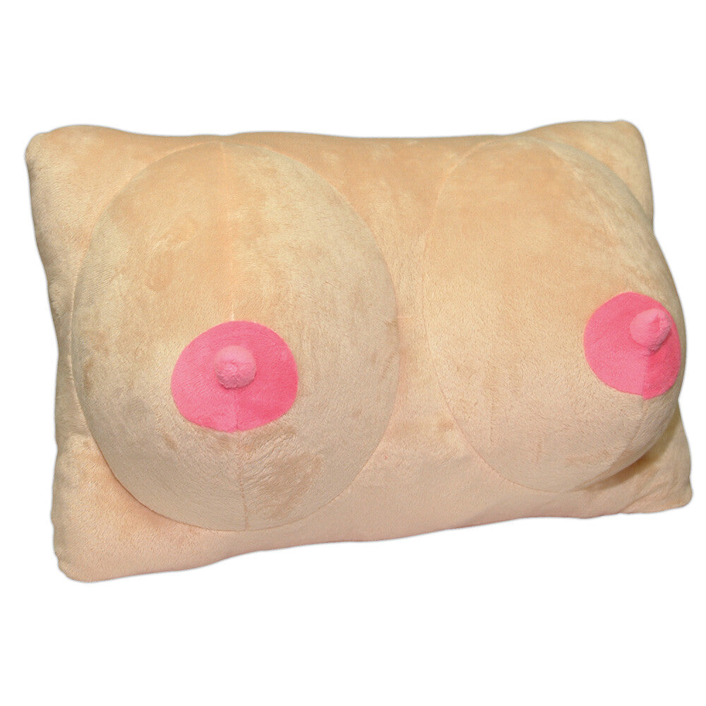 A skin-colored plush pillow with pink nipples, designed to resemble breasts. The pillow is rectangular and appears soft and flexible.