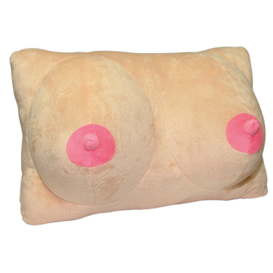 A skin-colored plush pillow with pink nipples, designed to resemble breasts. The pillow is rectangular and appears soft and flexible.
