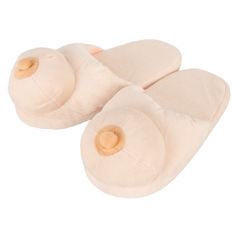 A pair of flesh pink boob-shaped slippers made from polyester.