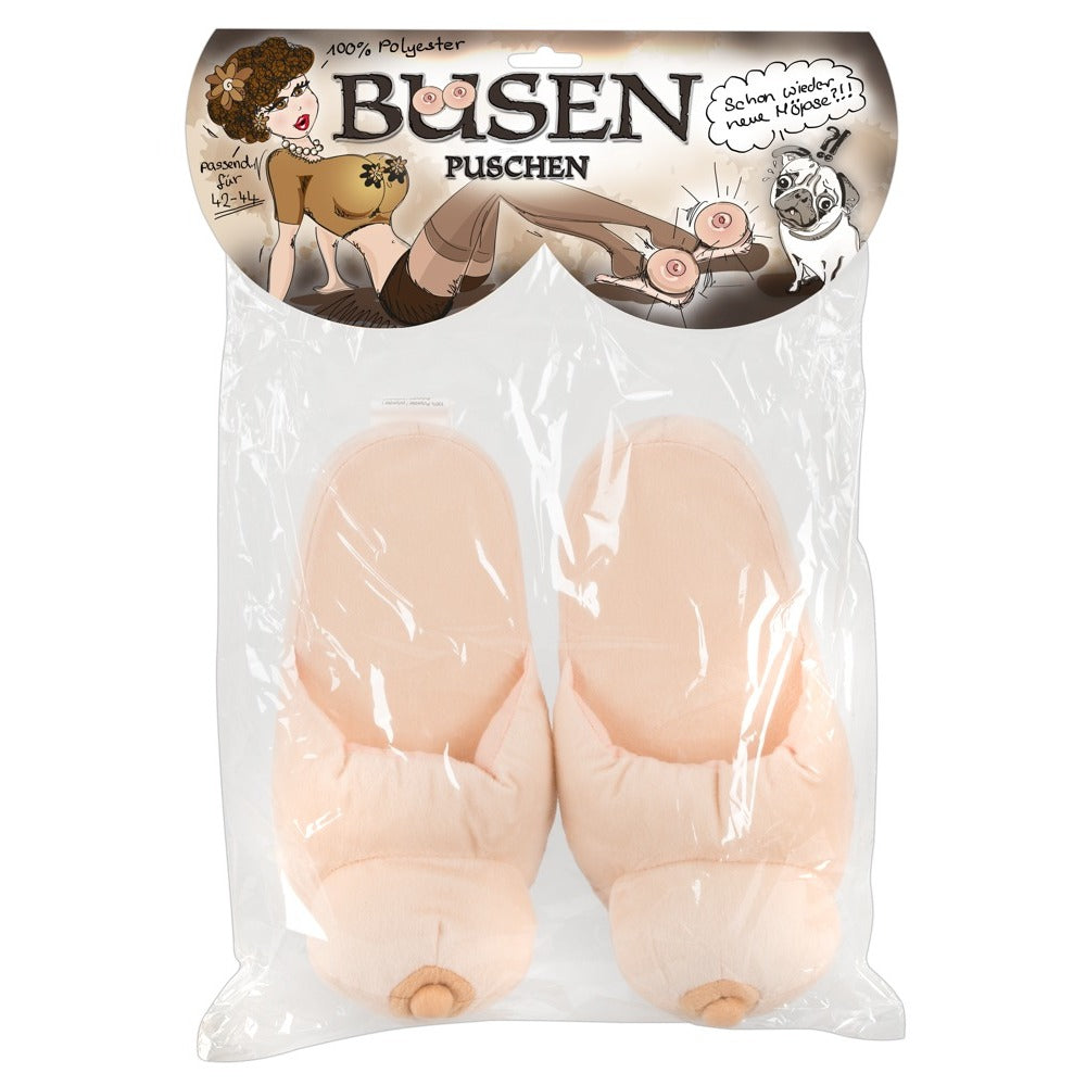 A pair of flesh pink boob-shaped slippers made from polyester.
