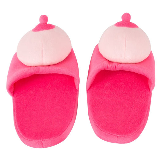 A pair of pink slippers made of fur fabric designed with boob-shaped tops.
