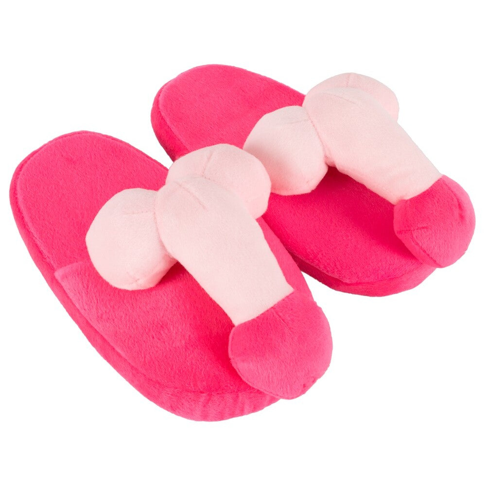 A pair of bright pink slippers with a penis-shaped design on the front.