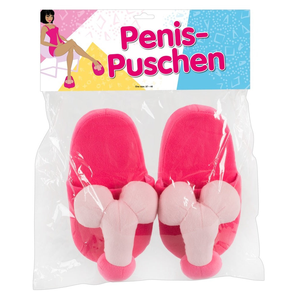 A pair of bright pink slippers with a penis-shaped design on the front.