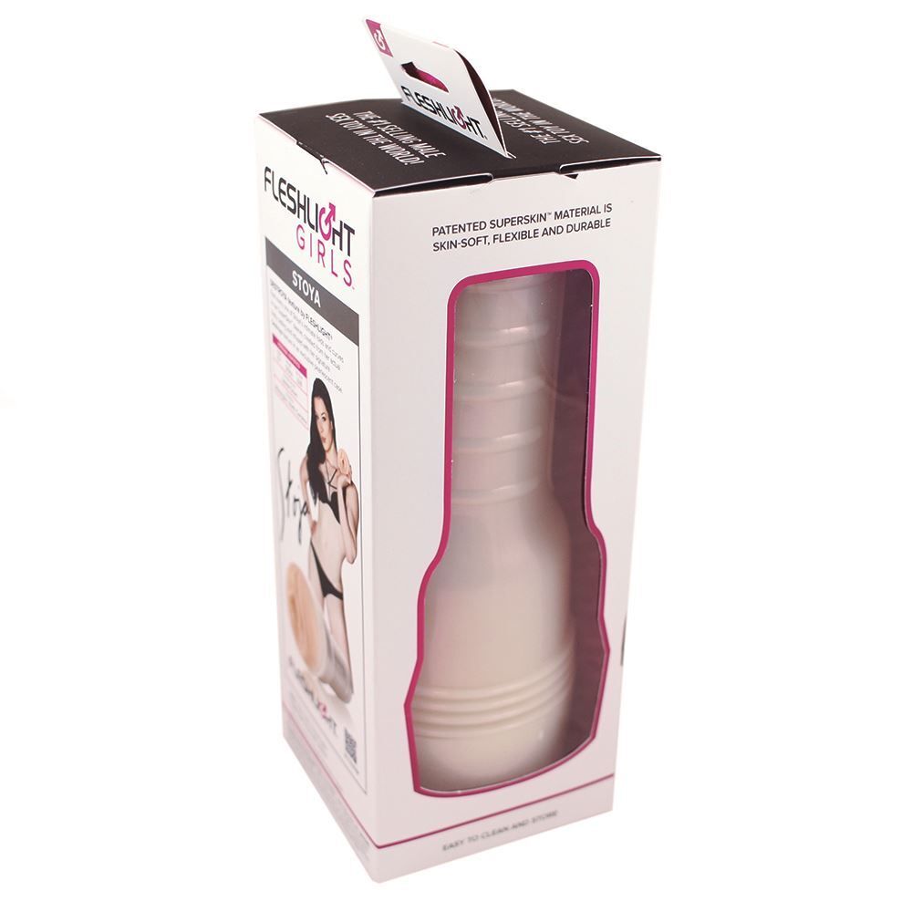 The image shows a product called the Stoya Destroya Fleshlight Girls Masturbator, which is a cylindrical device with a realistic flesh pink texture. There is also a photo of a woman in a black bikini, presumably the person whose body the product was modeled after.