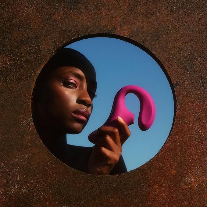 Purple and pink ergonomic internal stimulator with labeled features on a white background