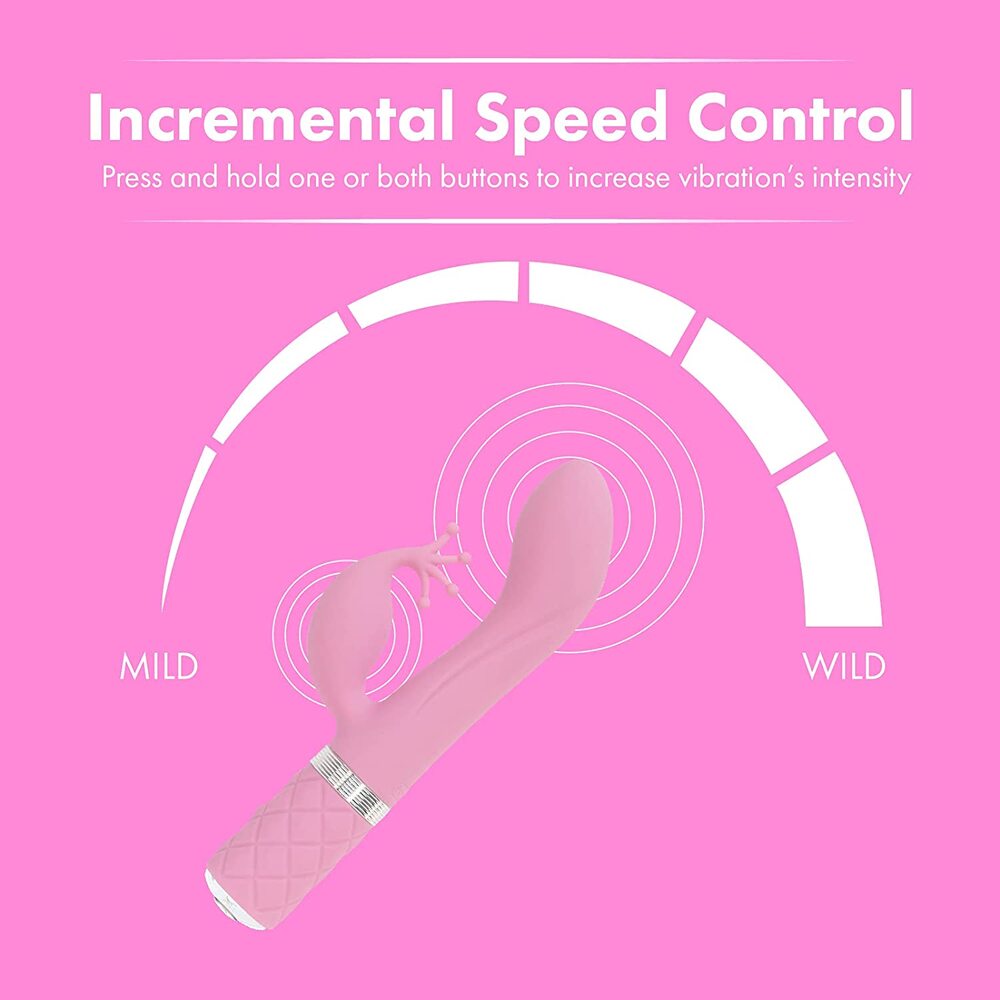 A pink dual motor vibrator with a curved design and a small protrusion on the side. The handle has a textured grip and a Swarovski crystal detail.