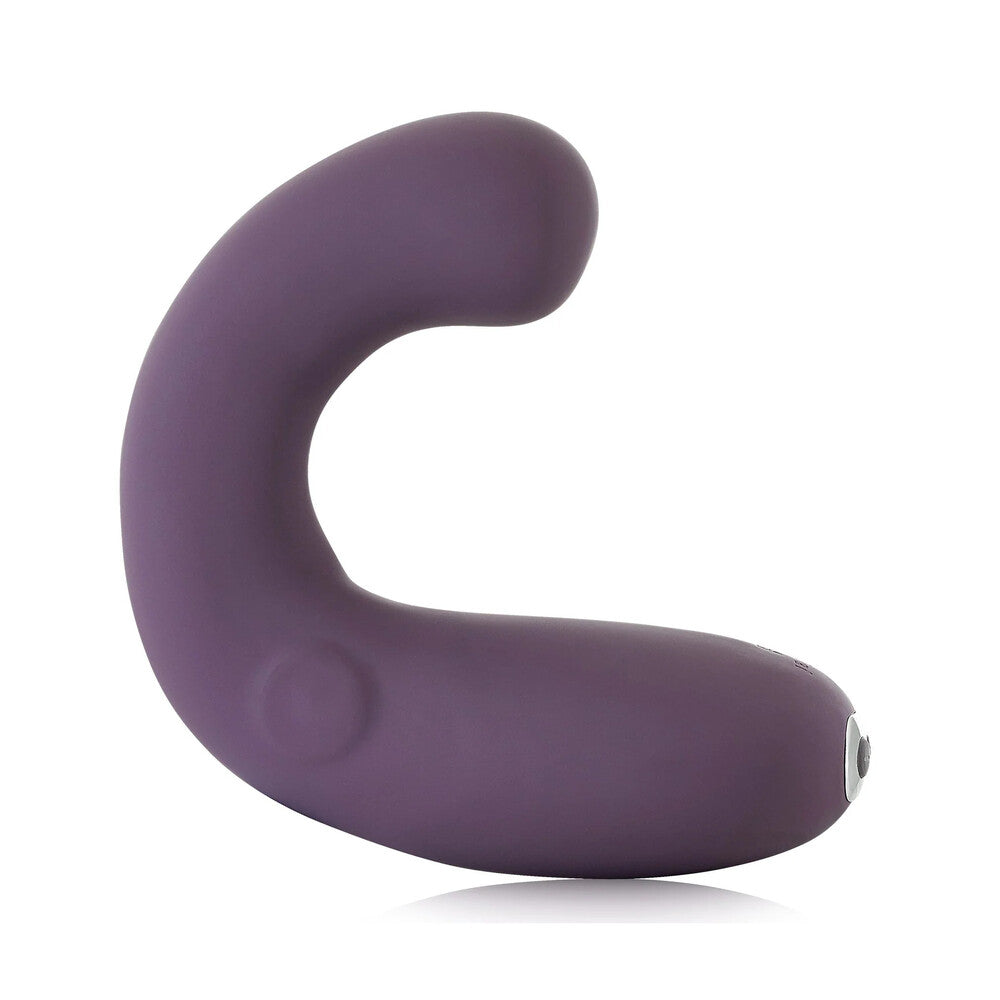 A purple, curved silicone stimulator with a smooth surface, featuring a button on its base for power control.